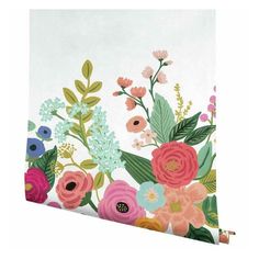 a white wall with colorful flowers on it