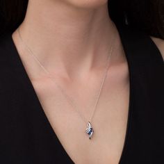 Create a sensation with this stunning three-stone pendant. Crafted in sterling silver, this marvelous design showcases a trio of graduated-size lab-created bright blue sapphires - the largest a 3.5mm stone - suspended diagonally in an elegant bypass frame. Buffed to a brilliant luster, this pendant suspends along an 18.0-inch rope chain that secures with a spring-ring clasp. Fine Jewelry Sapphire Heart Pendant, Sapphire Heart Pendant Birthstone Jewelry, Sapphire Heart Pendant Jewelry In Cubic Zirconia, Fine Jewelry Blue Three Stone Jewelry, Sapphire-colored Cubic Zirconia Heart Pendant Jewelry, Sapphire Jewelry With Lab-created Sapphire, Silver Sapphire Jewelry As Gift, Gift Sapphire Jewelry With Lab-created Sapphire, Silver Jewelry With Lab-created Sapphire For Gift