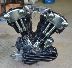 the motorcycle engine is sitting on the ground