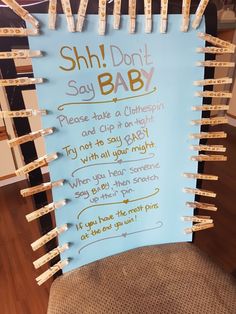 a sign that says shh don't say baby on the back of a chair