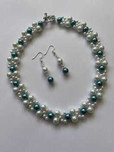 "Elegant glass pearl set Perfect for adding a finishing touch to your outfit  Elegant and feminine  Necklace with matching earrings  8mm white glass pearls  8mm teal glass pearls  4mm white glass pearls  16\" in length Necklace is finished with pretty flower design tbar fastening  Earrings to match 8mm white & teal glass pearls  Silver plated bead caps Silver plated ball spacers Silver plated hooks  Approx drop 3cm HAPPY TO ALTER COLOUR OR LENGTH ON REQUEST" Silver Pearl Beaded Jewelry Sets, Wedding Pearl Beaded Jewelry Set, Pearl White Jewelry Sets With Round Beads For Wedding, Festive White Pearl Jewelry Sets, Elegant Adjustable Turquoise Jewelry Set, Elegant Pearl White Beaded Jewelry Sets, Beaded Bridal Jewelry, Mint Necklace, Feminine Necklace