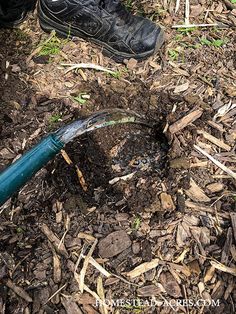 a person digging in the ground with a shovel