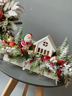 a christmas centerpiece on a table with ornaments