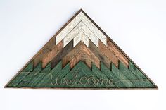 a wooden sign that says welcome on it