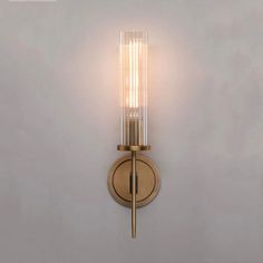 a light that is on the side of a wall next to a white wall and some lights