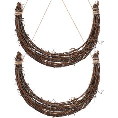 two wreaths made out of twigs hanging from strings