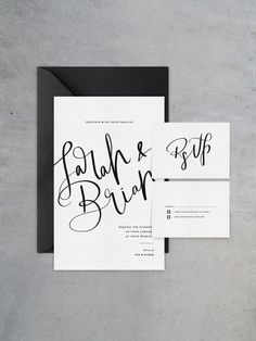 the wedding stationery is shown with black and white calligraphy