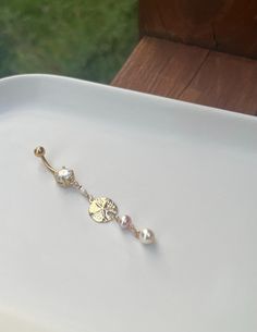 a pair of earrings sitting on top of a white plate