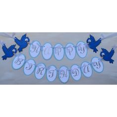 a birthday banner with blue birds on it