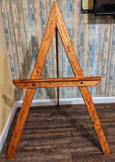 a wooden easel leaning against a wall