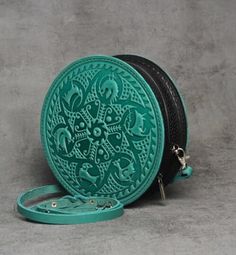 Elevate your accessory game with this stunning handmade round leather bag for women.  Crafted from premium genuine calf leather, this leather evening bag is the epitome of luxury and style. The unique embossing technique used to create this mint green round bag gives it a one-of-a-kind look that is sure to turn heads.  Whether you're heading to a special occasion or simply need a stylish daily bag, this cross body bag is the perfect choice. This everyday bag is not just a fashion statement, but Round Bags As Gift, Leather Bags With Round Handle For Gifts, Leather Round Case Shoulder Bag As Gift, Leather Round Case Shoulder Bag, Handmade Round Bag For Everyday Use, Handmade Round Shoulder Bag For Everyday Use, Daily Purse, Embossing Techniques, Embossed Bag