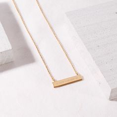 Keep a reminder of a place that is important to you by creating a custom Coordinate Necklace to be engraved with the latitude and longitude of a place that you choose. Popular coordinates include the place you were engaged, married or graduated from. Available in 14k gold plated, rhodium plated or 14k rose gold plated brass Bar size: 1 1/4" by 1/4" 16" cable chain with 2"extender Lobster claw closure Made in the USA With engraving this item is FINAL SALE SKU: BYN1030 Minimalist Laser Engraved Rectangular Pendant Jewelry, Elegant Nameplate Necklace With Laser Engraving, Minimalist Jewelry With Engraved Text For Everyday Use, Minimalist Nameplate Necklace For Anniversary, Minimalist Everyday Jewelry With Engraved Text, Elegant Laser Engraved Nameplate Necklace, Minimalist Rectangular Jewelry With Engraved Text, Minimalist Rectangular Pendant With Engraved Text, Minimalist Gold Name Necklace With Engraving Option