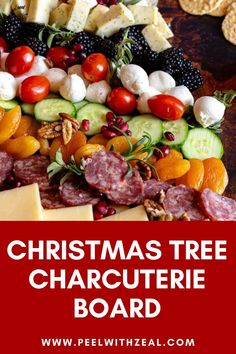 christmas tree charcuterie board with cheese, crackers and fruit on it in the background