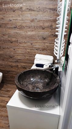 a bathroom sink sitting on top of a white pedestal