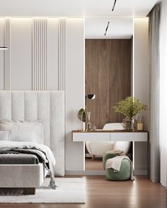 a modern bedroom with white walls and wood flooring, along with a large bed