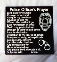 a police officer's prayer with handcuffs and handcuffs on the back of a pillow