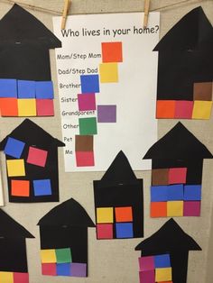 a bulletin board with different colored houses on it