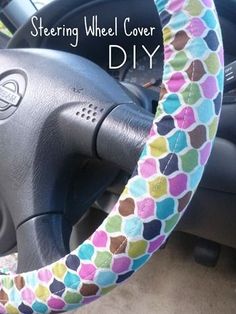 the steering wheel cover is decorated with multicolored circles and has been made to look like