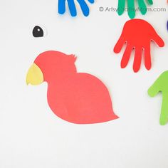 Here's a colorful handprint parrot craft to brighten up your day! Perfect for young kids to use their hands and learn about different colors! Parrot Craft For Kids, Handprint Parrot, Parrot Craft, Bird Craft, Oldest Human, Hand Crafts For Kids, African Grey Parrot, Bird Crafts, Handprint Art