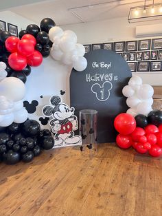 balloons and mickey mouse decorations are on display