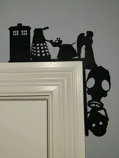 the silhouettes of doctor who appear to be in front of a mirror and door