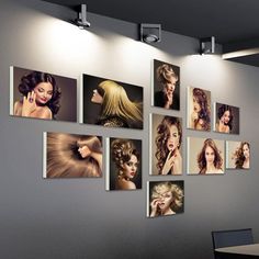 there are many pictures hanging on the wall in this office area, with one woman's hair being styled