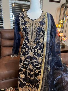 Ready to wear can be shipping same business day. Color     Dark blue (blackish) Fabric    shirt, dupatta tissue                  trousers Qatan silk Embroidery details  Total handmade adda work Kora, Dabka, Stones, Pearls Kiran on all four side borders and stones spray  On dupatta. The fabric used in this dress is very high quality. Embroidery is very elegant and neat and gives designer look. Camera lighting can not do justice the dress in person is way more beautiful. Size medium  Shoulder 15 Chest 20 Waist 18.5 Hip 20.5 Sleeve length 20 Shirt length 42 Pants length 40 If you need same dress in different sizes please free to ask for availability. Thanks.