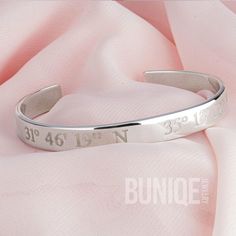 📍 This stylish Coordinates Cuff Bracelet, handcrafted from 925 sterling silver, features a personalized engraving of your chosen coordinates.  Perfect as a coordinates gift for marking a special location or occasion! The adjustable bangle design ensures a comfortable fit for any wrist, making it an ideal piece of personalized jewelry.  Whether you're looking for a unique Christmas gift or a thoughtful boyfriend gift, this engraved bracelet is a standout choice for both men and women.  📏 Size & Materials: Style: Custom Coordinates Cuff Bracelet Materials: 925 Sterling Silver, 24K Gold Plated Thickness: 1.8mm (0.6") bracelet Width: 8mm (0.25") Sizes: 140mm (5.5") 155mm (6.5") 170mm (7.5") ✍️ How to Order: When placing your order for this personalized engraved wristband, provide your coordi Sterling Silver Engraved Bangle For Anniversary, Personalized Sterling Silver Name Bracelet Bangle, Adjustable Engraved Name Bracelet In Sterling Silver, Adjustable Sterling Silver Name Bracelet With Engraving, Silver Customizable Cuff Bangle Bracelet, Personalized Sterling Silver Name Bangle, Silver Customizable Cuff Bracelet, Adjustable Sterling Silver Name Bracelet Engraved, Engraved Stainless Steel Bangle As Gift