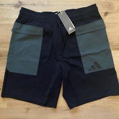 Adidas Style: The Pack Shorts Color: Black With Army/Olive Green Accent Colors Size: Men’s Large These Brand New With Tags Adidas Men’s Shorts Are In The Style “The Pack Shorts.” They’re In Perfect Condition, Since They Are Brand New. They Are Perfect For Exercising, Athleisure, Or A More Casual Look. The Shorts Are Made From A Cotton/Polyester Blend. They Have Side Pockets As Well As One On The Back Top Center. Add These Shorts To Your Wardrobe For A New Stylish Look! Green Cargo Sports Shorts, Green Adidas Cotton Bottoms, Adidas Green Bottoms For Summer, Adidas Black Shorts With Built-in Shorts, Adidas Green Sports Shorts, Adidas Black 2-in-1 Shorts, Adidas Green Sporty Shorts, Adidas Sporty Green Shorts, Sporty Green Adidas Shorts