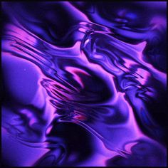 an abstract purple and black background with wavy lines