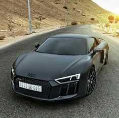 an audi sports car is shown on the road