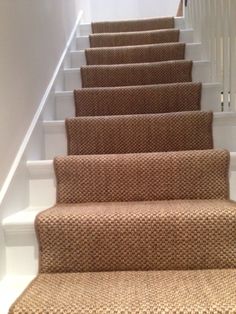 the carpeted stairs in this house are clean and ready for us to walk down