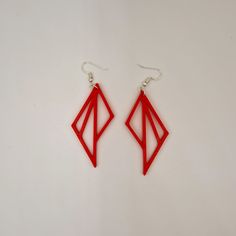 pair of red earrings on white background