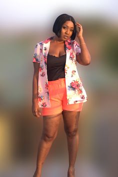 Elevate your casual look with our women's 2-piece set featuring a flowery pink blazer-style shirt and pint shorts. Handmade in Ghana, this chic ensemble combines elegance with comfort, perfect for brunch or a casual day out. Crafted from soft, breathable fabric, it offers a flattering fit and vibrant style. Available in various sizes Short Floral Print Summer Tops, Summer Short Sleeve Short Set For Day Out, Floral Print Shorts For Spring Day Out, Summer Short Set With Short Sleeves For Day Out, Casual Short Blouse For Day Out, Feminine Floral Print Shorts For Day Out, Feminine Floral Print Vacation Shorts, Summer Vacation Button-up Shorts, Casual Short Set For Spring