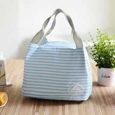 Insulated Lunch Bag for Women Thermal BagThis Insulated Lunch Bag ⁤for Women offers reliable food‌ and beverage protection. This useful thermal bag can be utilized ‍on various outdoor activities such as camping, hiking, or family ⁢picnics. Conveniently⁤ prepare ⁤your food at home, ⁤then store‌ them in this bag for later‌ consumption. The bag&apos;s ⁤insulation feature aids in maintaining the temperature of its contents for an ⁣extended period.Ideal for‍ everyday use, this container is particularly beneficial for those constantly‍ on the go. Through ‍this, you gain more control ‍over your food intake by allowing you to bring your‍ homemade meals, thus promoting a balanced diet. It fits neatly into anyone&apos;s meal planning⁢ routine, enabling you to prepare meals⁤ in advance, and pack‌ the Small Lunch Bags, Thermal Lunch Bag, Mens Lunch Bag, Women Lunch Bag, Canvas Lunch Bag, Cool Lunch Boxes, Bento Bags, Lunch Tote Bag, Best Lunch Bags