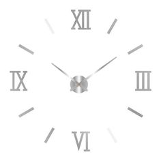 a white clock with roman numerals on the face and numbers in silver color