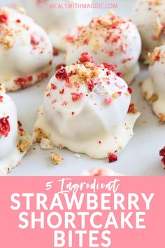 strawberry shortcake bites with white frosting and sprinkles