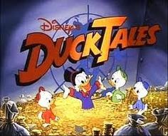 ducktales title screen with cartoon characters in the foreground and an animated background