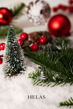 christmas decorations and pine trees in the snow