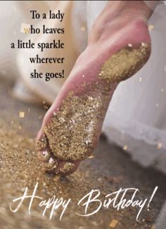 a hand reaching for some gold glitter on top of a birthday card that reads, to a lady who leaves a little sparkle wherever she goes