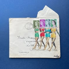 a postcard with three women in swimsuits and one has a stamp on it