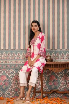 Indulge in elegance with our Pink Tie And Dye Suit Set. The beautiful pink hue and handwork make it the perfect statement piece for any occasion. Crafted from luxurious organza, the delicate tassels add a touch of charm to this unique and sophisticated ensemble. Elevate your wardrobe with this exclusive piece. No. of pieces - 2 piece set. Color - Pink. Kurta Fabric - Organza. Washing Instructions - Dry Clean. Pink Dori Work Sets For Eid, Pink Designer Wear Sets For Spring, Pink Silk Sets With Dori Work, Elegant Pink Georgette Kurta, Unstitched Pink Sets With Resham Embroidery, Pink Silk Sets With Dupatta, Pink Silk Set With Dupatta, Elegant Pink Organza Sets, Pink Organza Kurta For Wedding