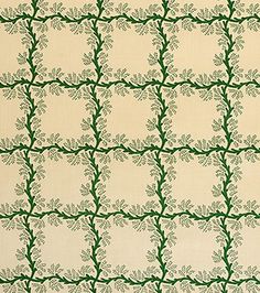 a green and white wallpaper with vines on it