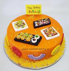 a birthday cake with different types of food on it