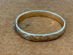 ad eBay - Find many great new & used options and get the best deals for 9CT 9 CARAT METAL CORE ROLLED GOLD BANGLE ENGRAVED BRACELET 14.7G 1/5TH USED at the best online prices at eBay! Free shipping for many products! Gold Engraved Sterling Silver Bangle Bracelet, Ornate Engraved Gold Bangle Bracelet, Scrap Gold, Metal Core, Engraved Bracelet, Gold Bangle, Gold Price, Gold Bangles, Ebay Finds