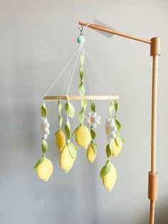 a mobile with lemons and leaves hanging from it