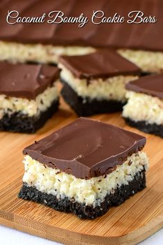 chocolate and coconut candy cookie bars on a cutting board