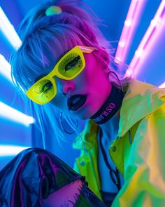 a woman wearing neon colored sunglasses and black makeup