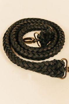 a black leather leash on a white background