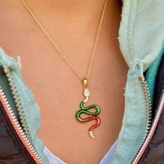 "This enchanting snake pendant is a statement accessory, perfectly combining elegance and a sense of mystery. It's an ideal gift for those who appreciate unique and captivating jewelry. Various options are available, Please visit animals section; https://www.etsy.com/shop/NNGJewellery?section_id=44912106 Material : 925 ct silver, enamel Weight : 2.95 gr Pendant Size :  37 mm x 20 mm. Colors : Gold Enamel colors : Green and orange Chain colors : Gold Chain size:  16\" + 2 '' (40cm + 5 cm) , 18'' + 2'' (45 cm + 5 cm) They will come with a gift box. All orders will be shipped out within 1-2 business days after the order has been received. Shipping : Standard Shipping usually taking 2-4 Business days to USA, 3-7 days to Canada, 7-15 Business days to Europe and Australia.  Please message us for Red Snake-shaped Jewelry For Gifts, Snake Chain Jewelry With Lobster Clasp As Gift, Snake Chain Jewelry With Lobster Clasp For Gifts, Snake-shaped Jewelry Gift, Snake Shape Clavicle Chain Jewelry As A Gift, Animal Necklace, Special Birthday Gifts, Snake Pendant, Christmas Gifts For Friends